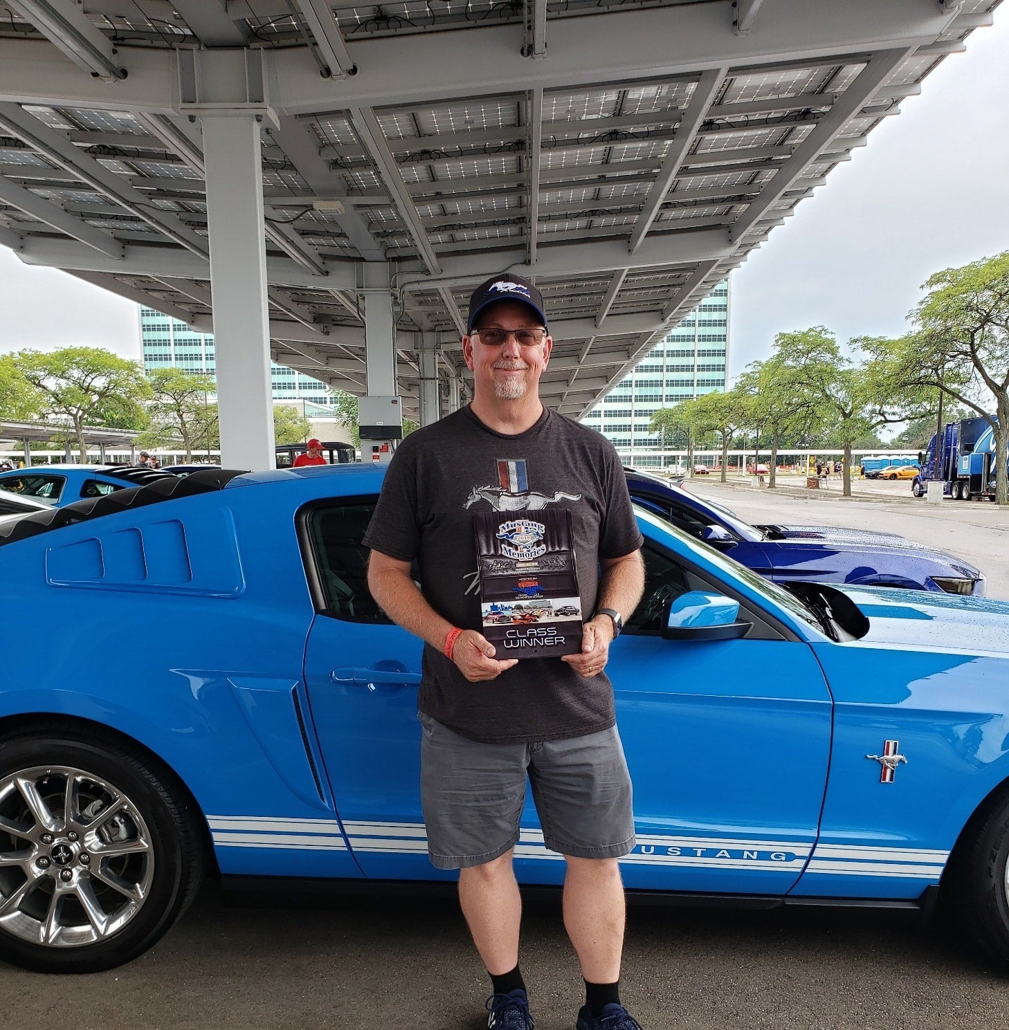 Mike Sadler in front of award-winning Mustang