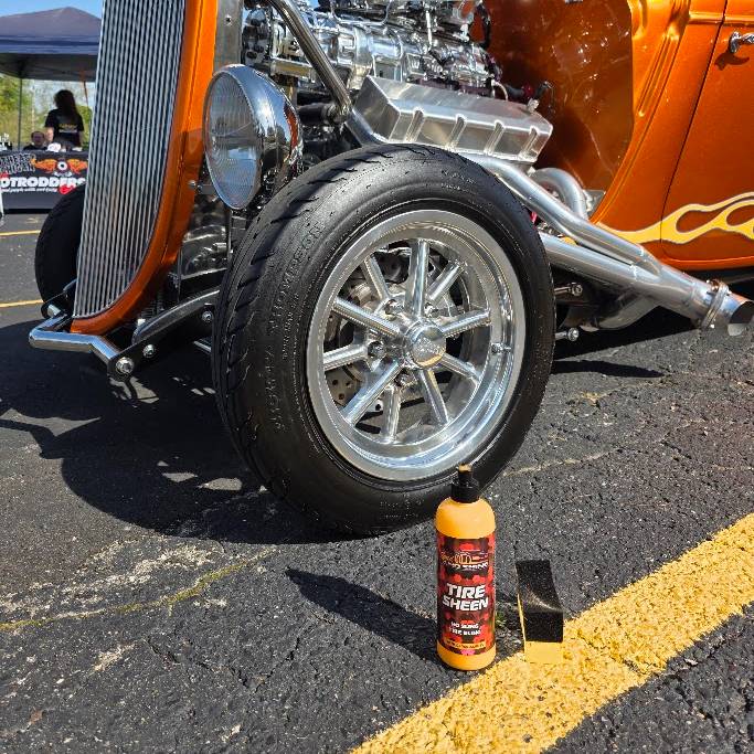 Tire Sheen | Medium Gloss Tire Dressing in front of a tire and orange vintage car